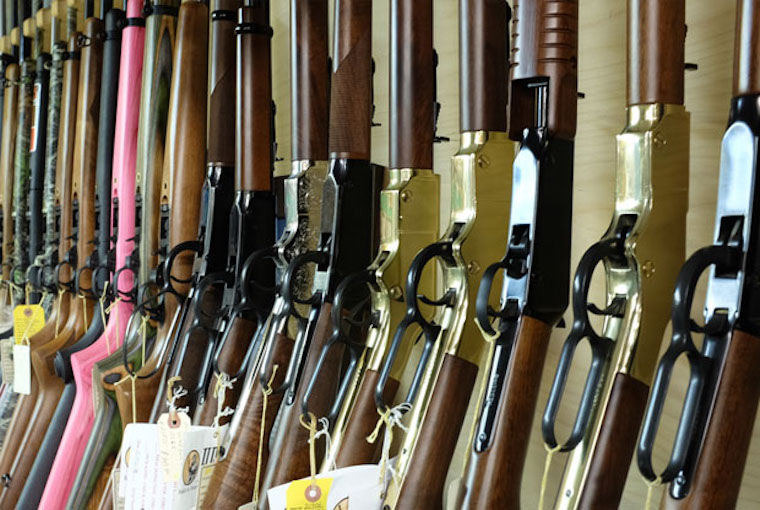 tagged firearms on a rack