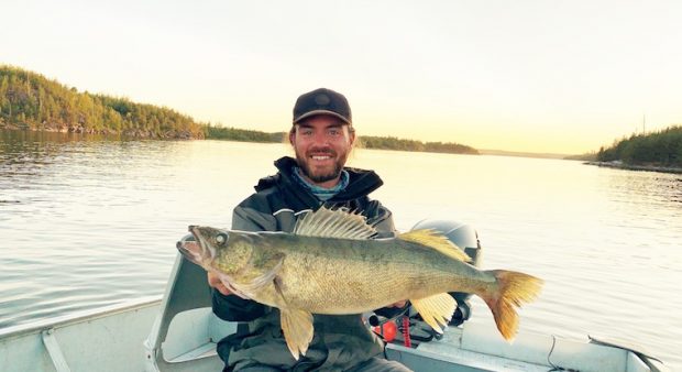 Man holds walleye