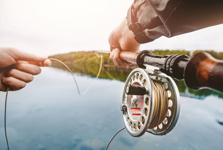 Fly rod and line in the hands of angler