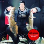 Photo Friday winner, Frank Kreisz of Orillia, shared this photo of his son Michael clutching a brace of burbot while ice fishing near Sioux Lookout.