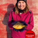 Photo Friday winner, Jason Barnucz of Delhi, submitted this photo of his wife Heather. She loves fishing, but isn’t always able to join the party. She caught this awesome pumpkinseed — a sunfish on a sunny day!