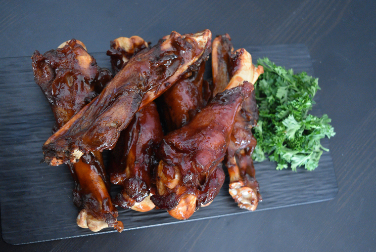 Six wild turkey wings glazed in honey hot sauce