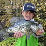 Max Calzonetti of Long Point enjoying wrapping up his spring crappie season at Long Point with his grandfather, David Martin. His smile says it all as he holds this 1.5-pound catch.
