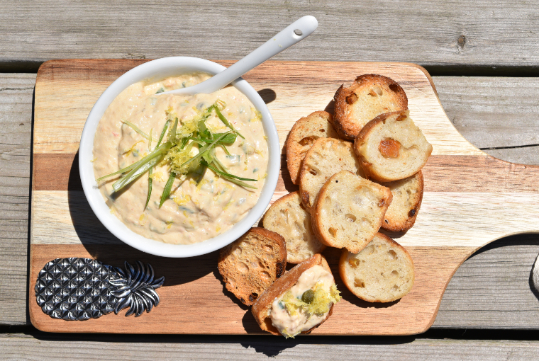 Smoked rainbow trout spread. 
(Bright and creamy-looking bowl of trout spread beside sliced bread)