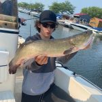 Joseph Kamendy of St. Catharines was thrilled to reel in this nearly eight-pound bowfin using a Mepps spinner while cruising through the Turkey Point Marina.