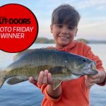 Photo Friday winner Joel Corda of Scarborough and son, Reggie caught this bass using a shallow running shad rap while fishing off the dock after dinner on Peninsula Lake. The smallmouth gave three good jumps before being netted, photographed, and released to leap another day.