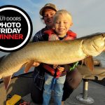 Photo Friday winner Jesse King of Peterborough, recorded Mom (and Max) catching this 46-inch Kawartha Lakes muskie during one last kick at the can.