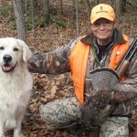 Jean Rapson of Coldwater has been hunting for 50 years and never leaves camp without Kash, shown here with his first retrieved bird.