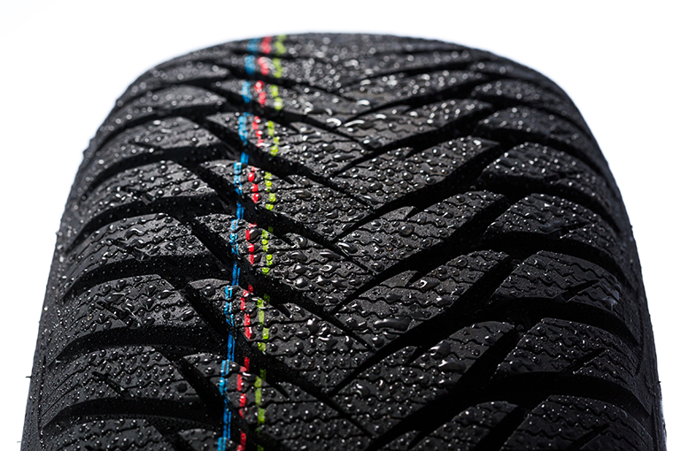 a close-up of a dewy tire