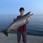 Jack Chassie of Hamilton threw a little Cleo off Bronte Creek pier and hooked into this 26-pound, 40-inch personal-best king salmon, with help from brother Cole.