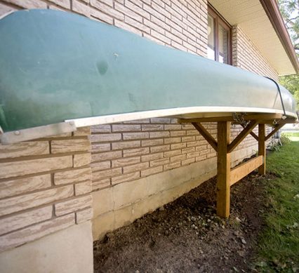 a Wolverine canoe on a wooden stand