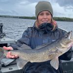 Elizabeth Blady (the Real Liz Blady) caught a 25-inch Lac Des Mille Lacs walleye in eight feet of water on a wind-swept shoreline, jigging with custom-made, lead heads tipped with minnows.