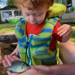 Jordan Scharfe of Port Carling says two-year-old Oliver caught his first fish with the help of his big cousin, Will.