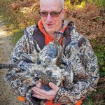 Steve Carkner of Ottawa displays an armful of success from his annual grouse hunt in North Bay.