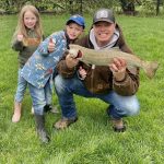 Matthew Harrison of Cookstown and his kids Hunter and Anja display their opening morning rainbow trout catch, which they brought home to Mom.