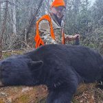 Russ Howe of Toronto with the bear he harvested after waiting for eight hours in a stand. It was all worth it for his first bear. It weighed 360 pounds after it was dressed.