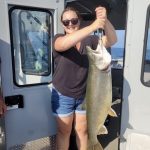 Allison Dart with a lake trout caught on Lake Ontario. It was a beautiful night out.