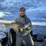 Marcel Brosseau was surprised with a walleye while fishing for salmon.