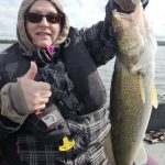 Melody Wales of Otterville posing with her personal best on a cold day on the lake.