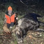 Natasha Boyce posing with her first moose.