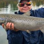 Sonja Hardy Mississauga posing with a beautiful Atlantic salmon.