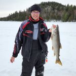 David Meek of Verner holds his first lake trout, a five-pounder caught in 30 feet of water. He used a 3/8 oz bright green jig head and a live minnow. The tip up barely moved.