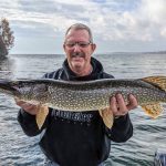 Gord Lewis of Huntsville poses with a 34-inch pike caught using a jig head and no leader. It was a fun way to end the 2023 boating season.