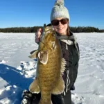 Andrea Poirier-Cornell of Atikohan was all smiles after catching the first smallie of the year through the ice. Andrea was fishing in -25-degree weather with high winds.