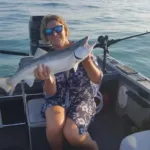 Becky Neufeld of London holds her second lake trout, caught in 400 feet of water, a mile out, on lead core.