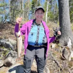 Gregory Fines of Huntsville says Maggie Fines caught her 18-inch, personal-best brook trout using a gold-bladed spinner and a worm from a stocked lake outside of Huntsville.