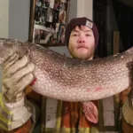 Hunter Porter of Temiskaming Shores holds a giant that nearly didn’t fit through the hole. Luckily, he was able to reel it in.