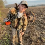 Jeremy and Colby Hiltz of Ailsa Craig set up a strutter decoy on a field edge and drew in this tom within 15 minutes. Colby, pictured, was back at home in time to catch the bus to school and share the story with his friends.