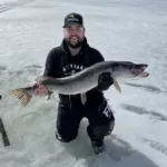 Miguel Trepanier of Cochrane poses with a 37-inch, 10.5-pound “gator” pike.