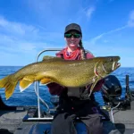 Pam Stewart of Perth went trout fishing in Lake Ontario for the first time and caught-and-released this 15.25-pound lake trout while trolling in 60 feet of water.