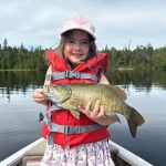 Avery Hill of Thunder Bay solo caught-and-released her first largemouth bass on Shebandowan Lake in FMZ 6.