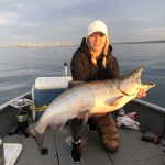 JohnJoe and Tierney Walker of Eganville spent five days fishing for kings on Lake Ontario; here Tierney is with a 28-pound chinook salmon.