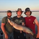 Austin Hutt of Ottawa says his buddy caught this big pike jigging with a minnow on Lake Nipissing during their annual fishing trip. From left are Kyle, Zach, and Olin.