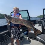 Steve and Beckett Ivits of Kingston were trolling deep water for lake trout when young Beckett hooked this pike, which was quickly released.