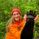 Emily Nixon of Red Rock with her first harvest: this 380-pound black bear, taken in Dorian with a crossbow.