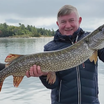 Robert Goulding of St. Catharines hosted his cousin, Artur Bauer (shown) of Hannover, Germany, who was excited to try Canadian fishing. Artur was most-pleased with this 42-inch pike, taken from Georgian Bay at Pointe Au Baril.