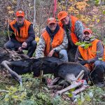 John Ross of Sault Ste Marie was party hunting in WMU 35 when Adam shot this bull one km into the bush. (Left-right: Adam, his father John, friend Mike, and brother Joseph).