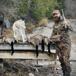 Bradley Thorn of Oshawa bagged a few Canadas from a homemade blind while hunting on the Bay of Quinte. Raymond the husky eagerly inspected the haul.