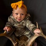 Nakina Crowder of Washago poses proudly with the deer her daddy, Donny, shot during bow season on the family farm this year before helping to prepare a venison stew with her mommy, Ashley.