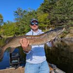 Francis Loranger of Huntsville caught his personal-best 41-inch pike on Georgian Bay the foggy morning after a big thunderstorm on calm waters. Photo by: Niklaus Speicer.