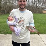 Laura and Clarke Wilkinson of Walkerton introduced their two-week-old daughter, Lilly, to fishing for browns on the Saugeen River.